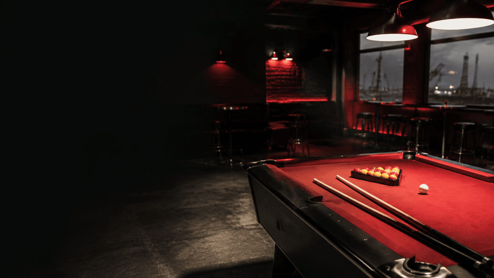 A red-felt pool table in a local Redcar club